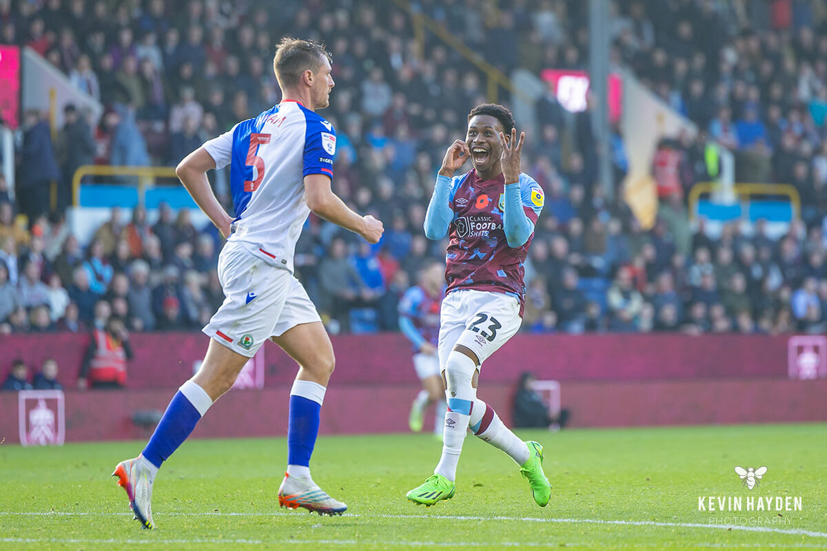 Burnley's Nathan Tella reminds Blackburn's Daniel Ayala what the current score is during the East Lancashire derby at Turf Moor, Burnley. Photo by Kevin Hayden.