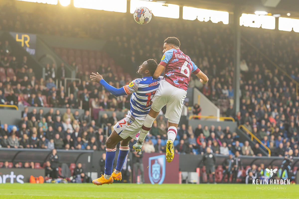 Burnley's CJ Egan-Riley wins a header against Reading's Abdul-Rahman Baba at Turf Moor, Burnley . Photo by Kevin Hayden.