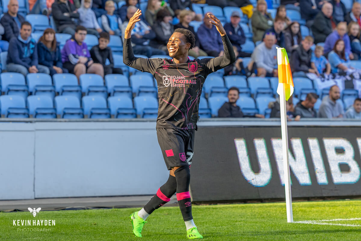 Burnley's Nathan Tela celebrates in front of the Burnley fans after his goal against Coventry City, Coventry Building Society Arena, Coventry. Photo by Kevin Hayden. Photo by Kevin Hayden.